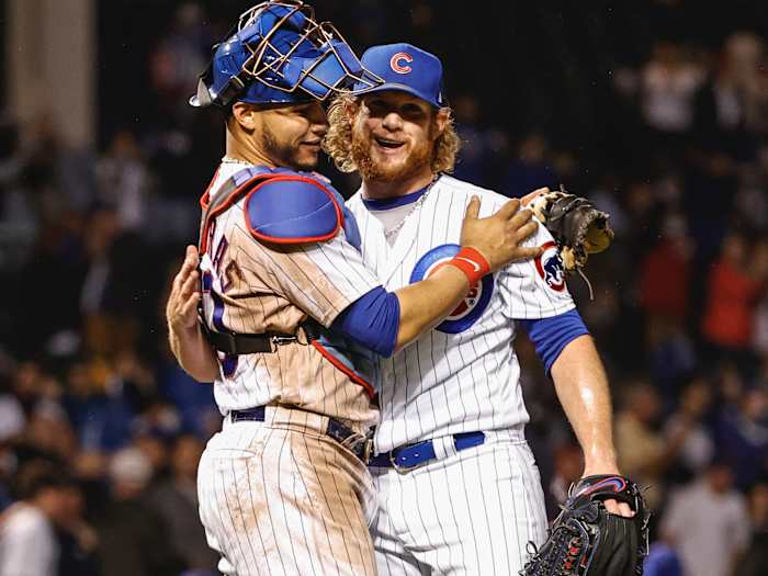 Chicago Cubs relief pitcher Craig Kimbrel (46) celebrates with catcher Willson Contreras (40) after delivering a final out against the Washington Nationals during the ninth inning at Wrigley Field.